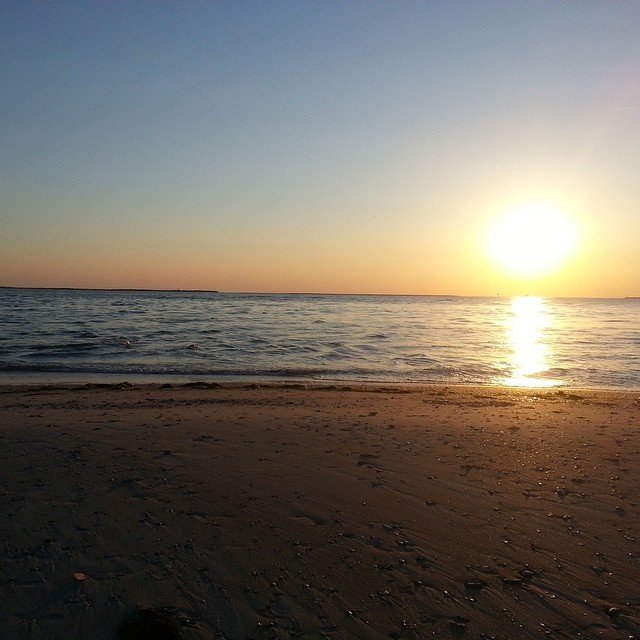 Low sun reflecting across still sound water at Cape Hatteras National Seashore