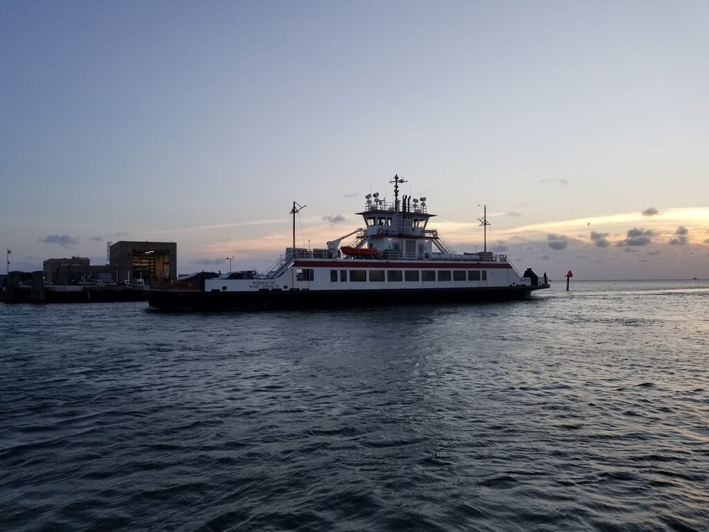 A ferry arriving from Ocracoke at dusk