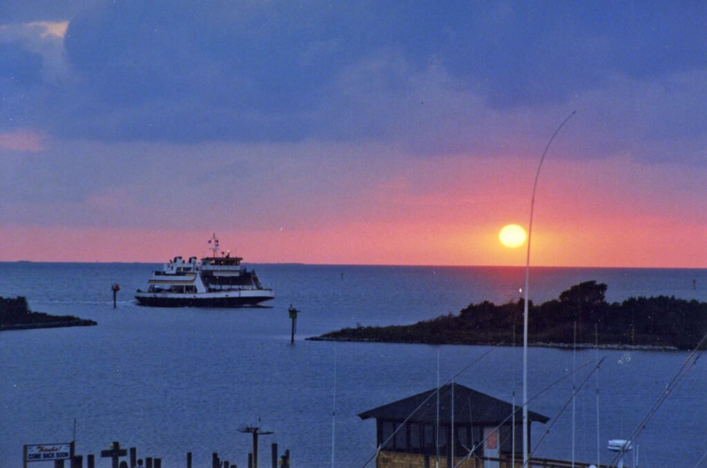 A ferry in Ocracoke harbor at sunset