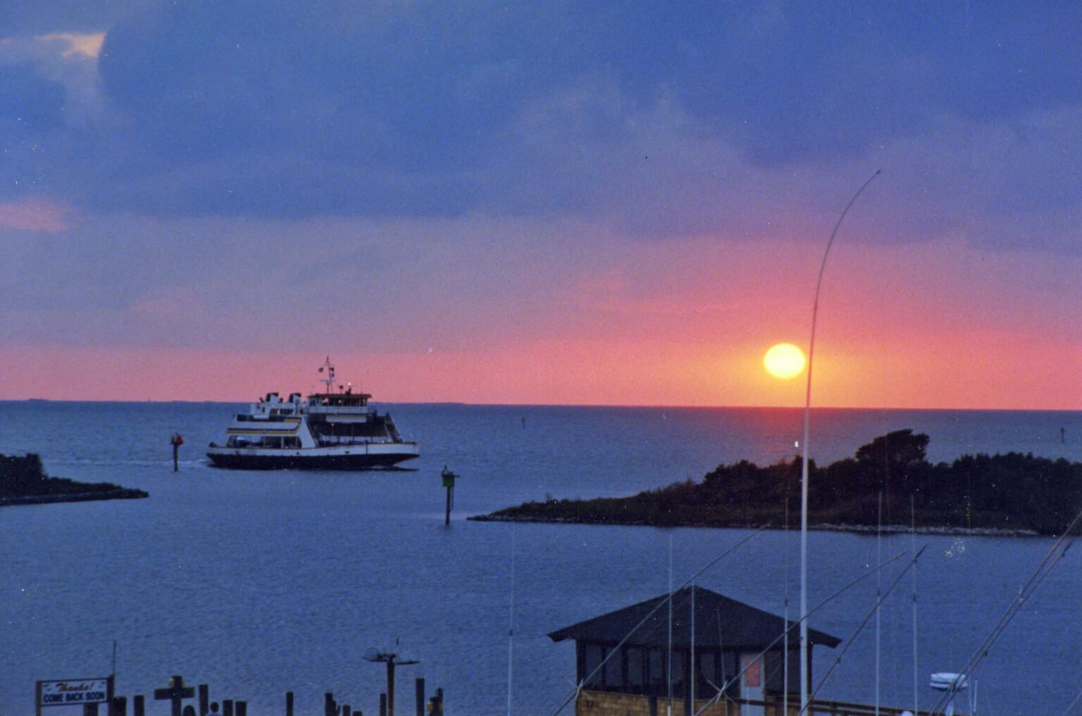A ferry in Ocracoke harbor at sunset