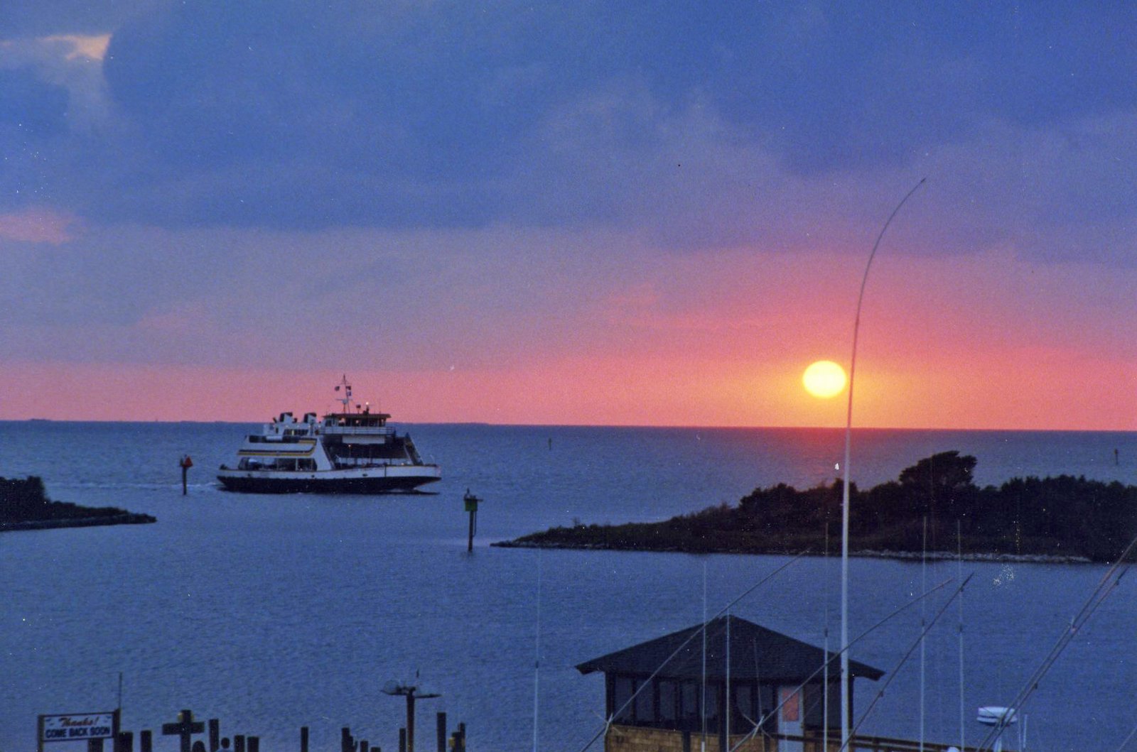 A ferry in Ocracoke harbor at sunset