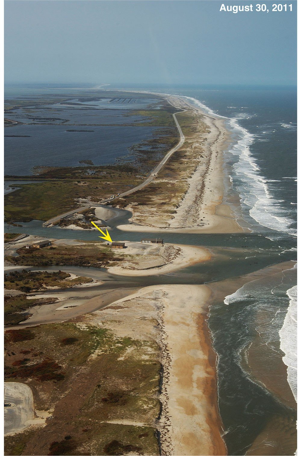 Aerial photo of the breach Hurricane Irene cut through Pea Island and Highway 12 near the old Pea Island station, August 30, 2011